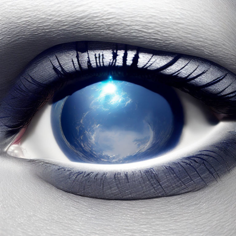 Digitally manipulated image of Earth reflected in eye with dark blue eyeliner.