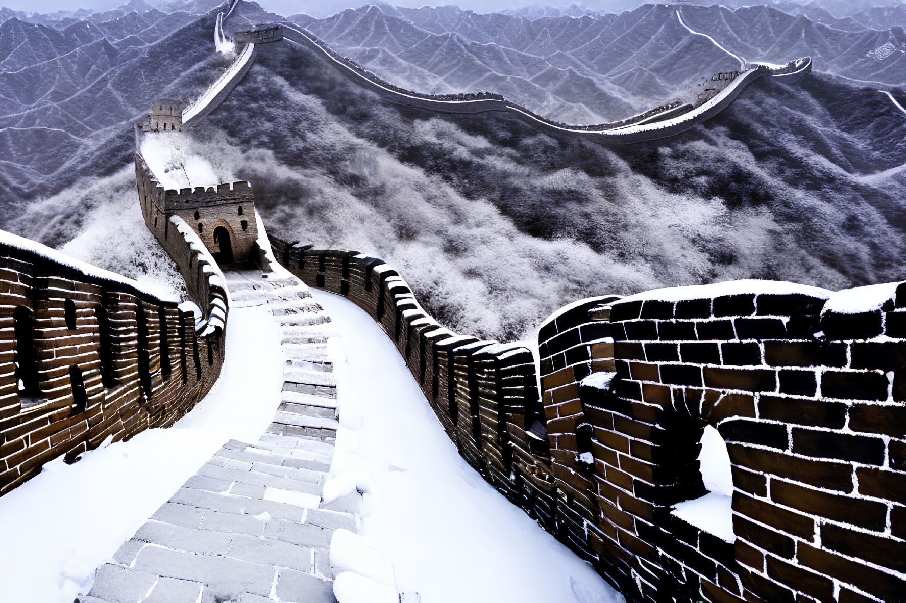 Ancient Great Wall of China in Snowy Mountains