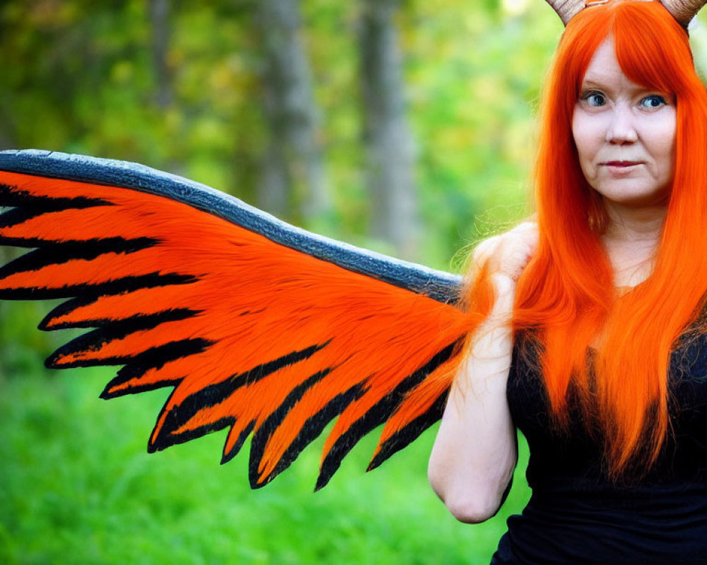 Orange-Haired Figure with Horns in Black Outfit and Wings in Forest