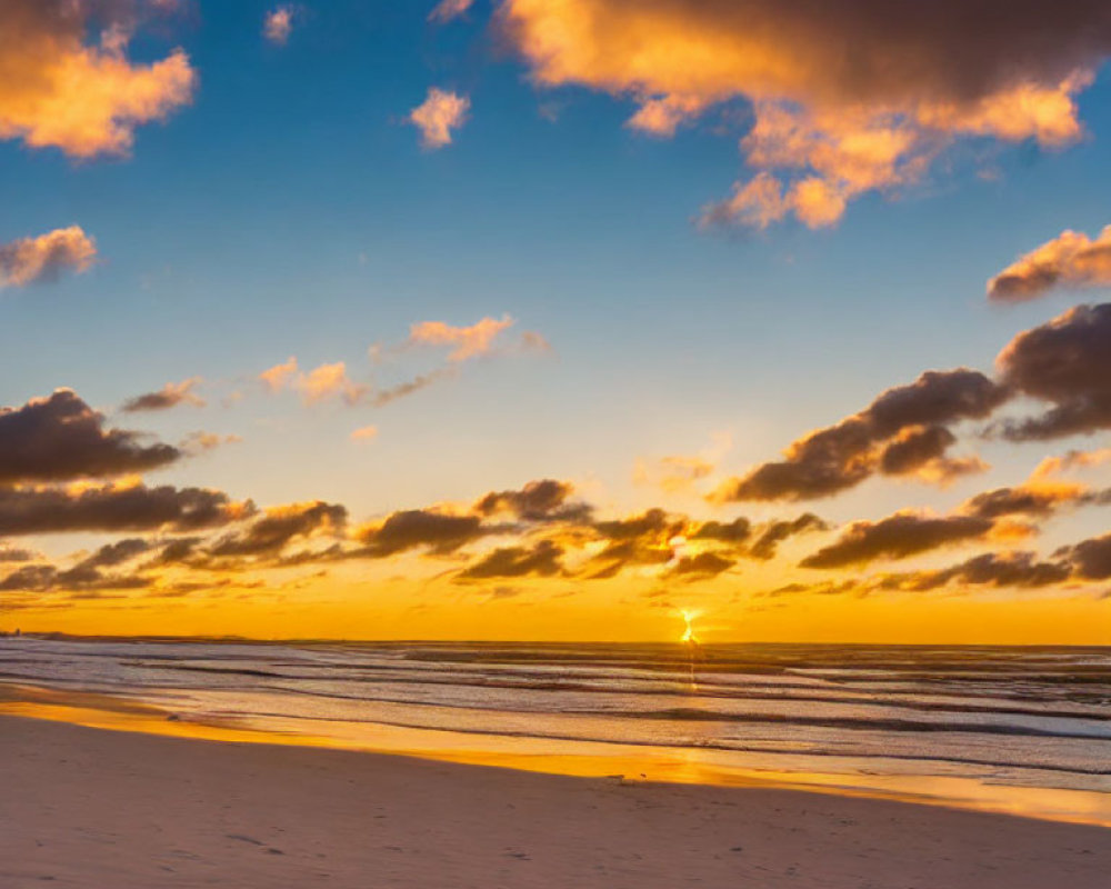 Tranquil sunset beach scene with warm glow and gentle waves