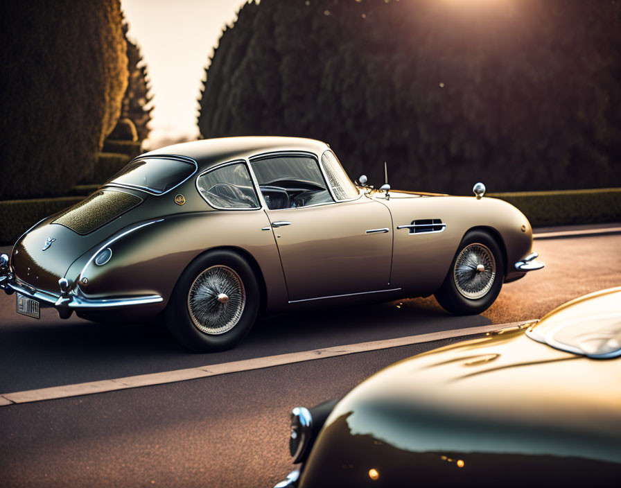 Vintage Car with Wire Wheels and Chrome Detailing Parked on Road at Sunset