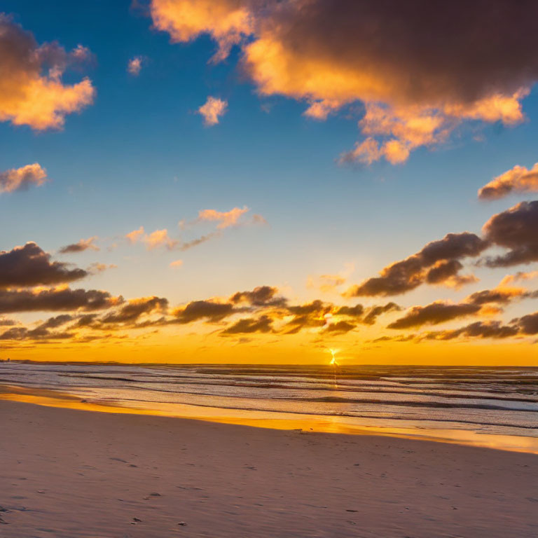 Tranquil sunset beach scene with warm glow and gentle waves