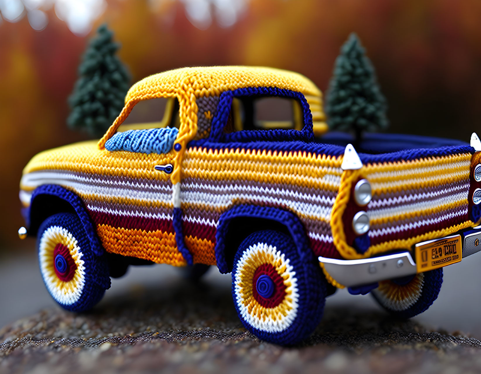 Colorful Knitted Toy Truck with Intricate Patterns Outdoors