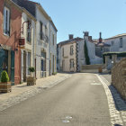 Historic street scene with cobblestones and quaint houses