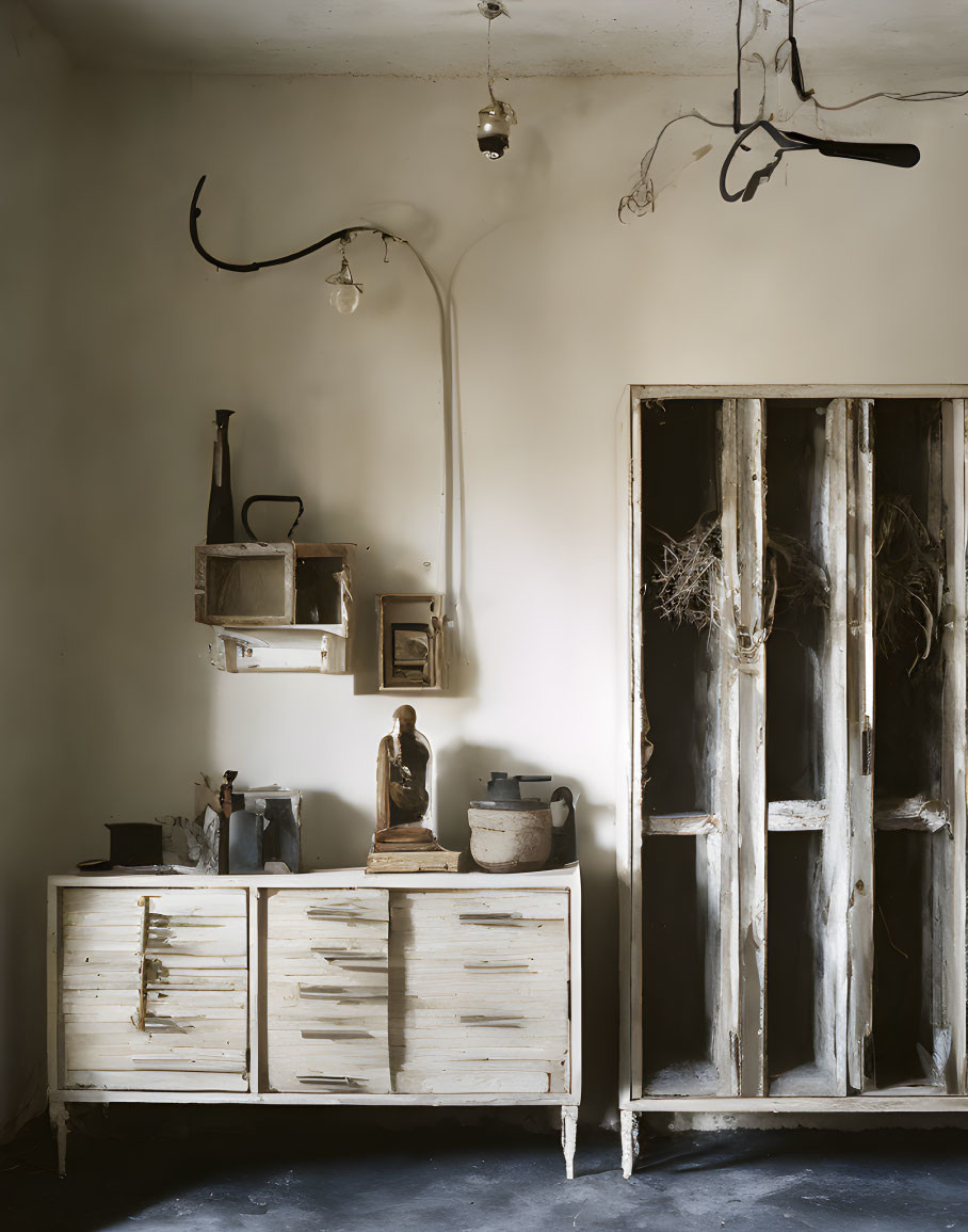 Vintage Room with Old Cabinet, Shelves, Sculpture, Jug, and Light Bulb