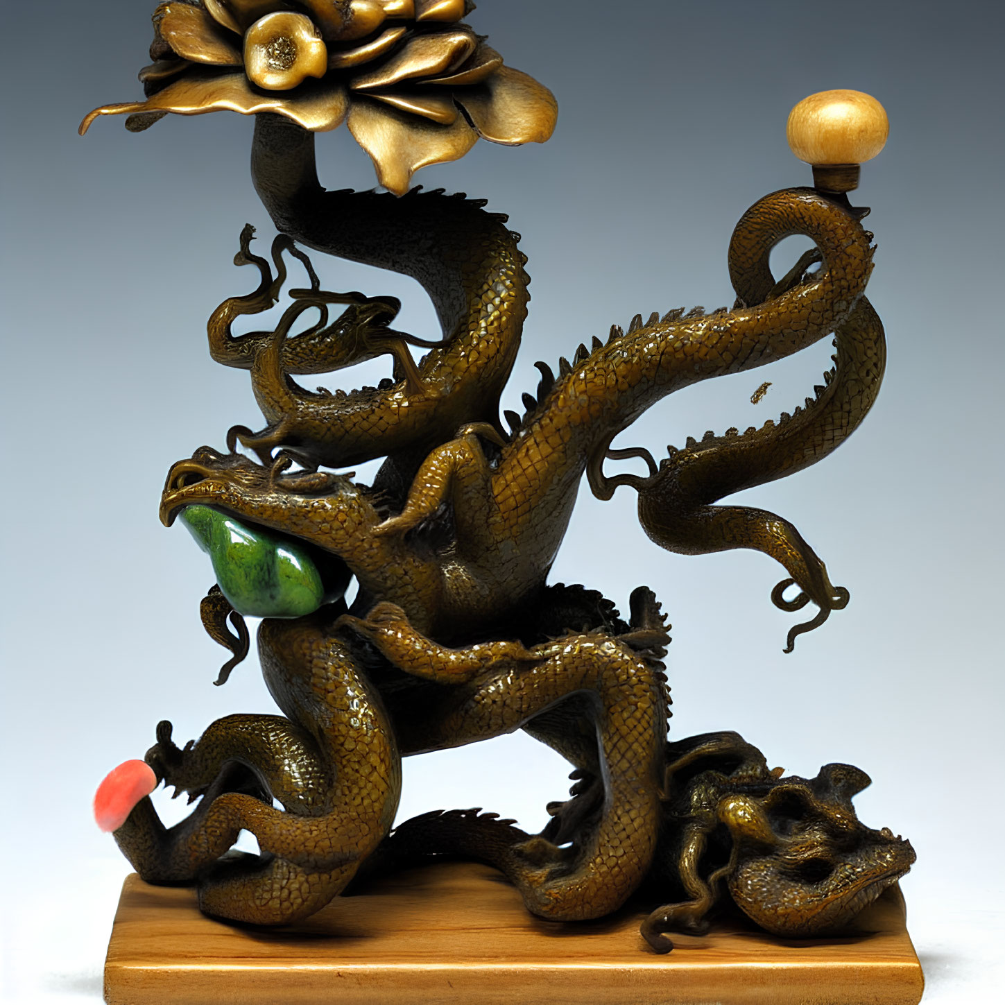 Intricate Dragon Sculpture with Pearl, Flower, and Wooden Base