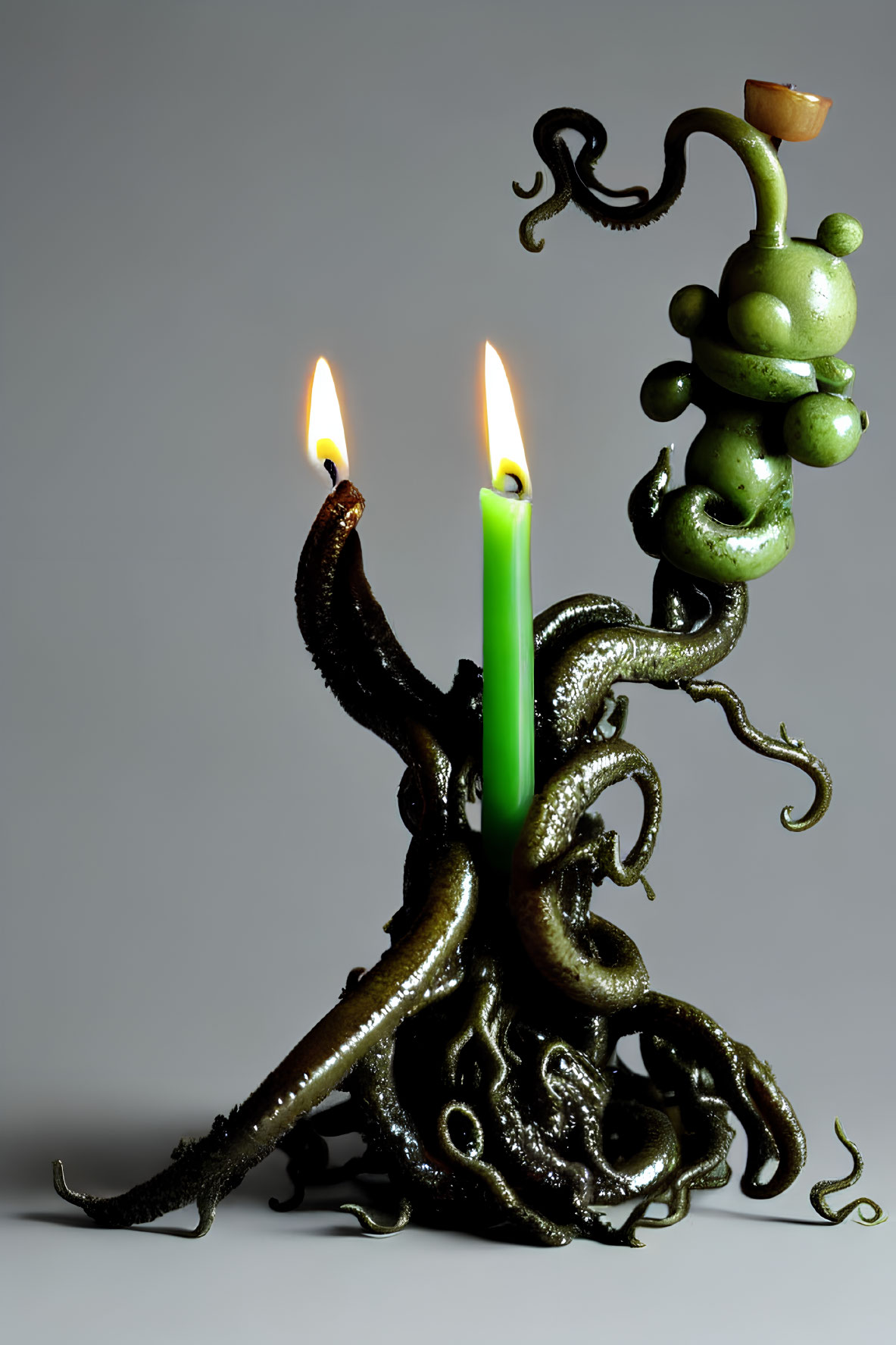 Surreal green candle held by dark octopus tentacle and vine with lit flames