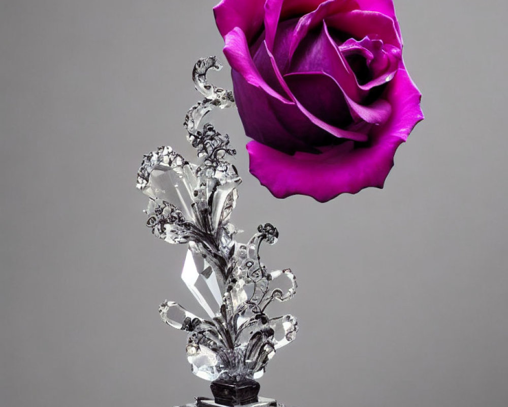 Purple Rose on Crystal Stem with Metal Leaves Against Gray Background