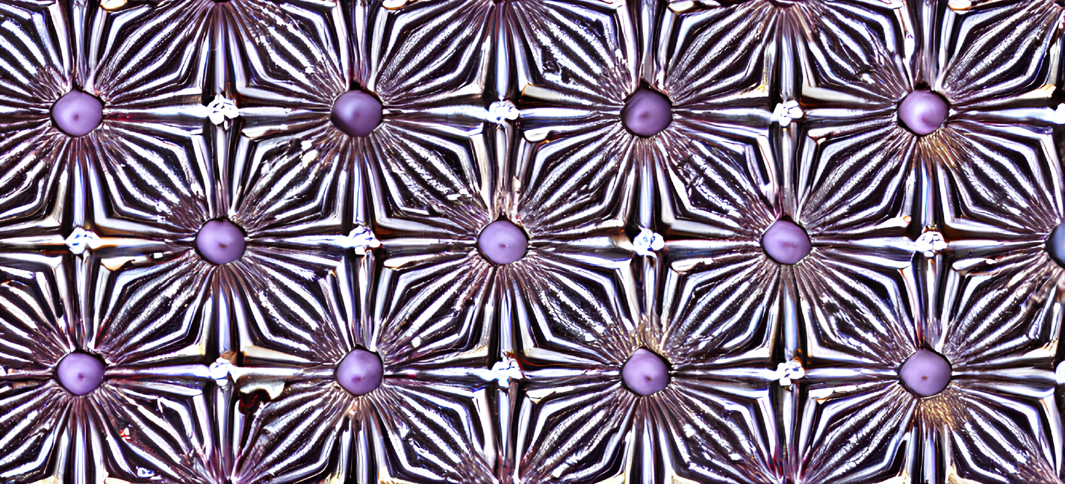 Metallic-Looking Flowers with Purple Centers on Dark Background