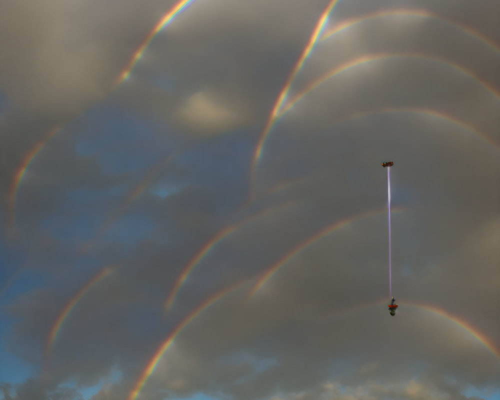 Digitally altered image of rainbow arches with crane hook.