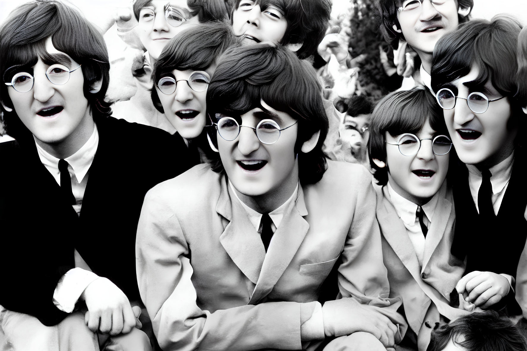 Monochrome photo of four iconic musicians' cardboard cutouts