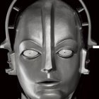 Humanoid Robot Head with Metallic Finish and Closed Eyes on Dark Background