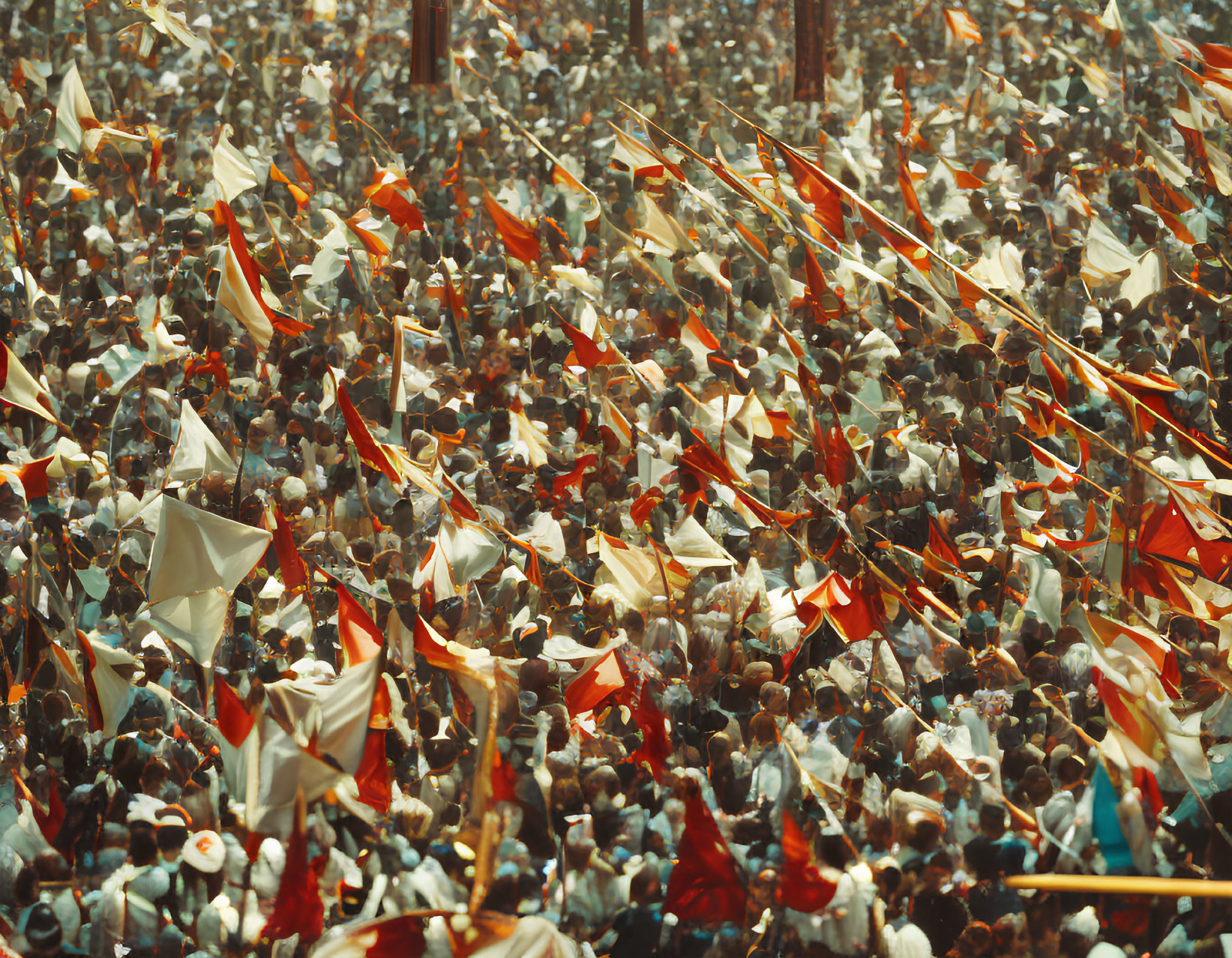 Crowded scene with white and red flags in vibrant display