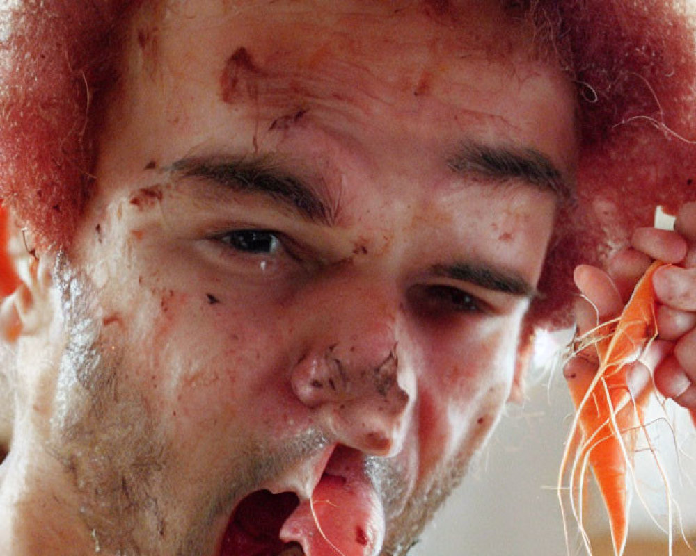 Red-haired person distressed with blood-like substance, biting carrot