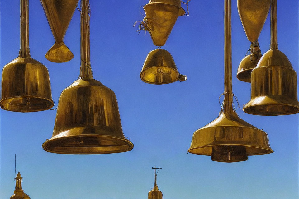 Golden Bells Hanging Against Clear Blue Sky