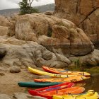 Colorful Wooden Boats on Tranquil Water Surface