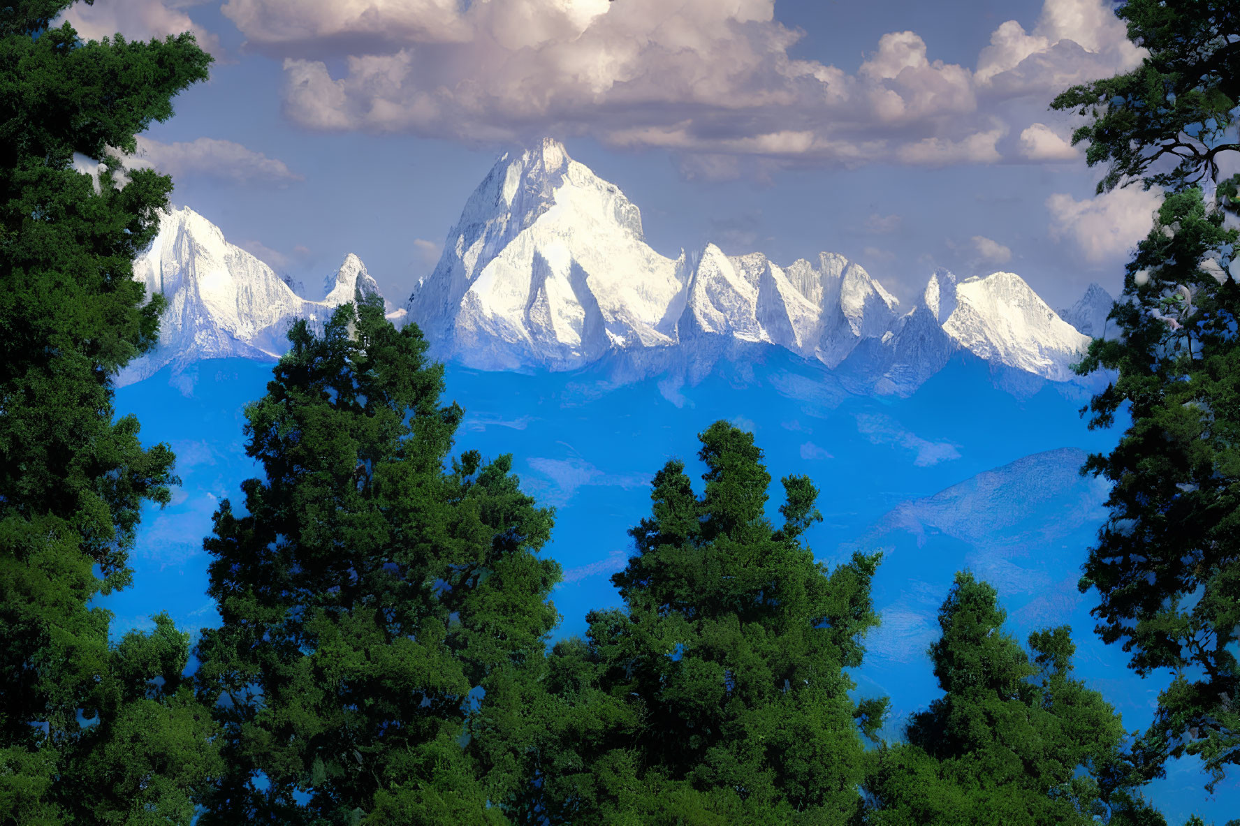 Majestic snow-capped mountain peaks and lush green trees under cloudy sky