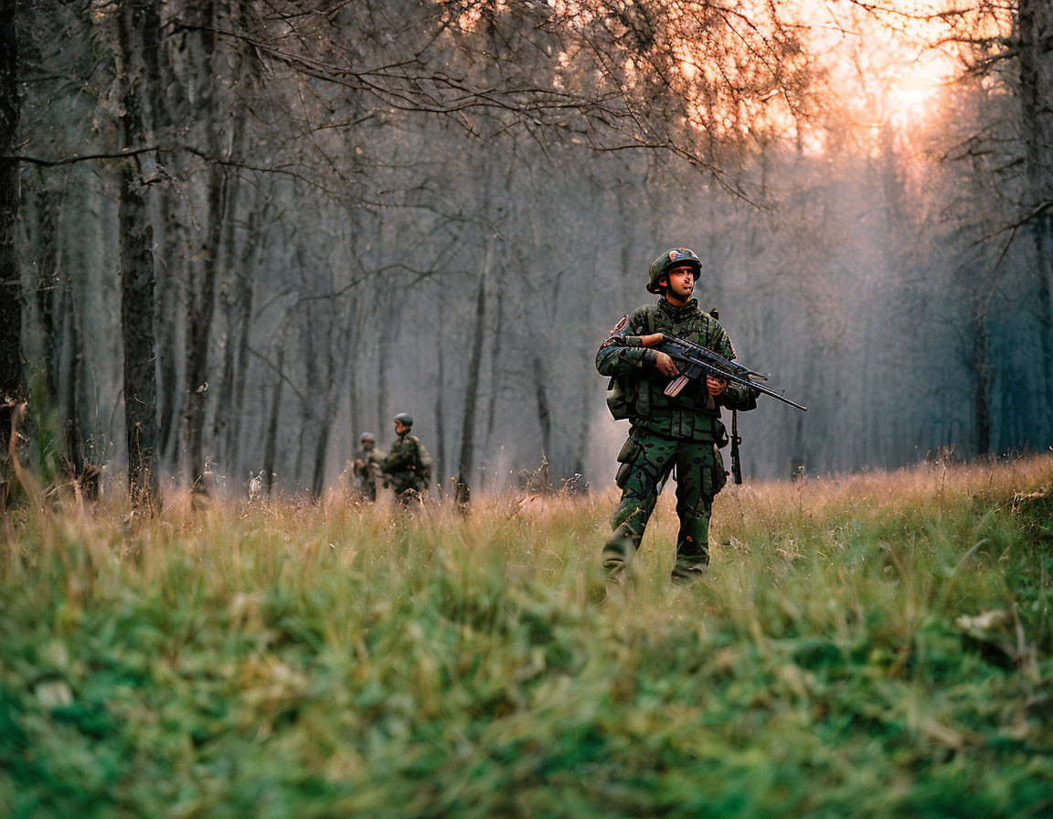 Military soldiers in camouflage gear patrol forest at sunset