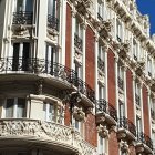 Ornate Victorian Townhouses with Balconies, Arched Windows, and Staircases