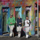 Vintage Attired Trio Strolling Vibrant City Street