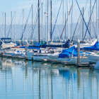 Tranquil marina with sailing ships on calm waters