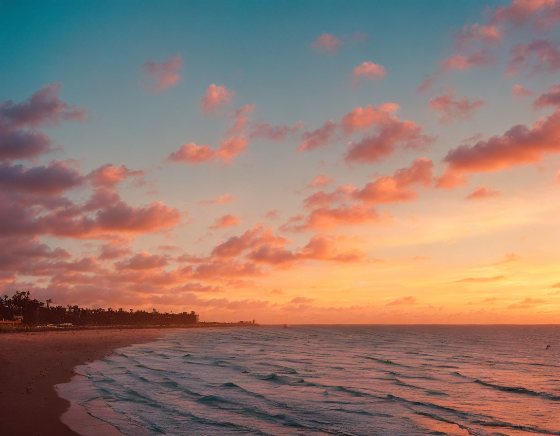 Tranquil sunset beach scene with pastel clouds and gentle ocean waves