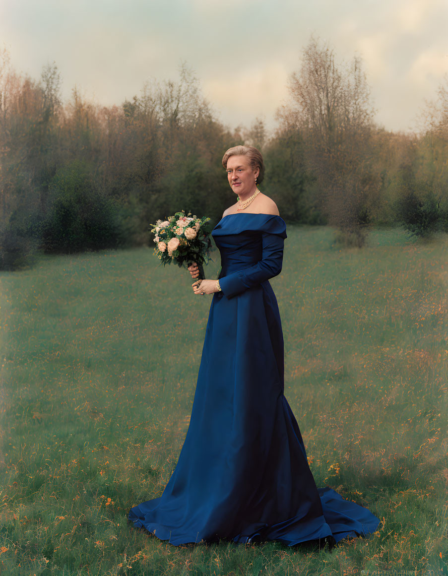 Person in Dark Blue Off-Shoulder Gown with Bouquet in Field