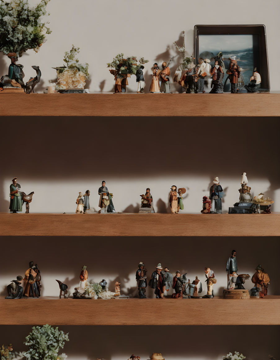 Small Figurine Display on Wooden Shelves with Minimalistic Lighting