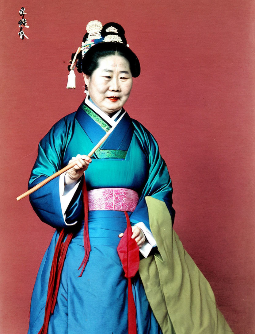 Traditional Korean Hanbok Woman with Drumstick on Red Background