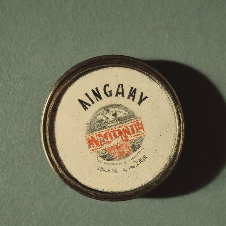 Vintage Round Tin Container with Worn "MUSTARD" Label on Greenish Surface