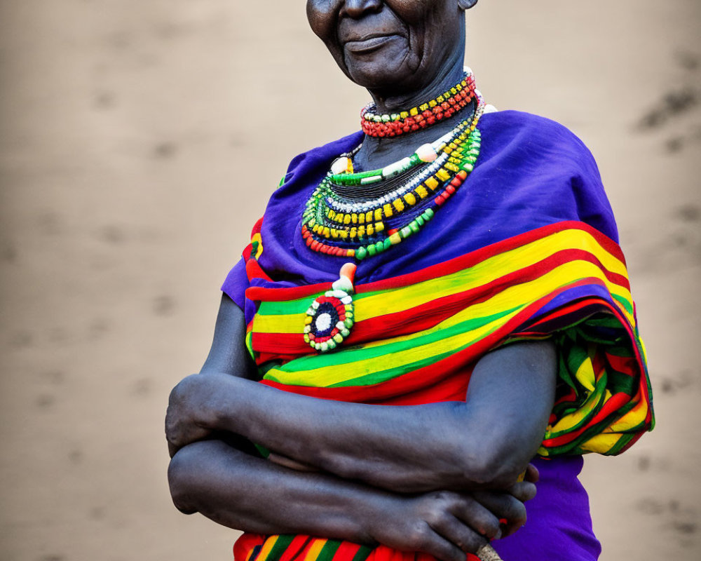 Elderly woman in colorful traditional dress and beaded necklaces