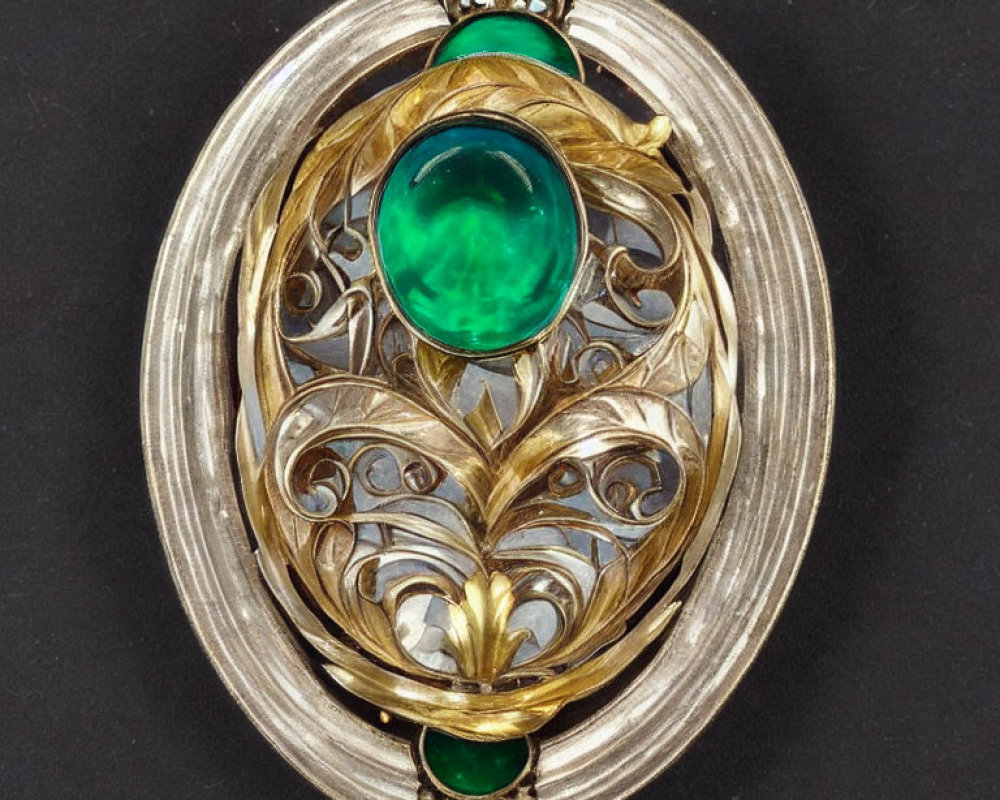 Oval Brooch with Gold Scrollwork and Green Gemstones on Silver Background