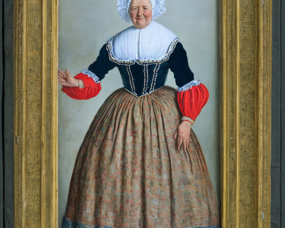 Elderly woman in traditional dress with white bonnet, black bodice, red sleeves, and