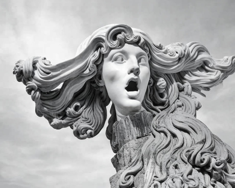 Monochrome photo of marble sculpture: Woman with flowing hair, mouth open.