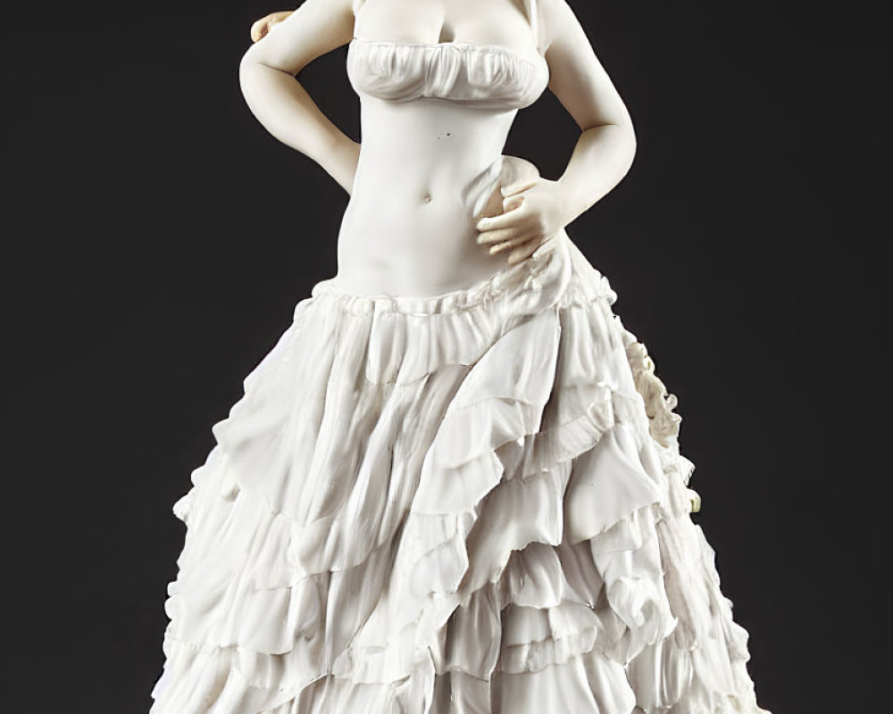 Porcelain woman figurine in layered skirt and flower hat on black background