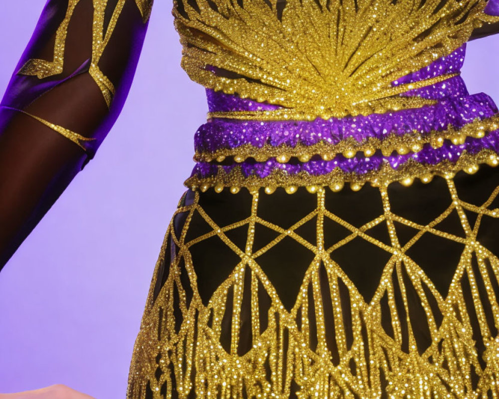 Detailed Costume with Golden Sunburst Embellishment on Black Fabric