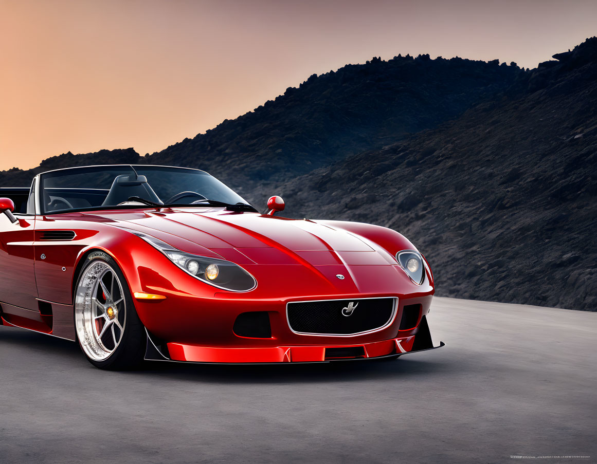 Red sports car with silver rims on open road at dusk