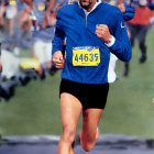 Elder Male Runner in Sunglasses and Beard at Marathon