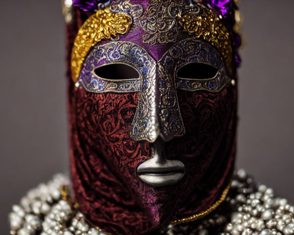 Intricate Purple and Gold Venetian Mask on Gray Background