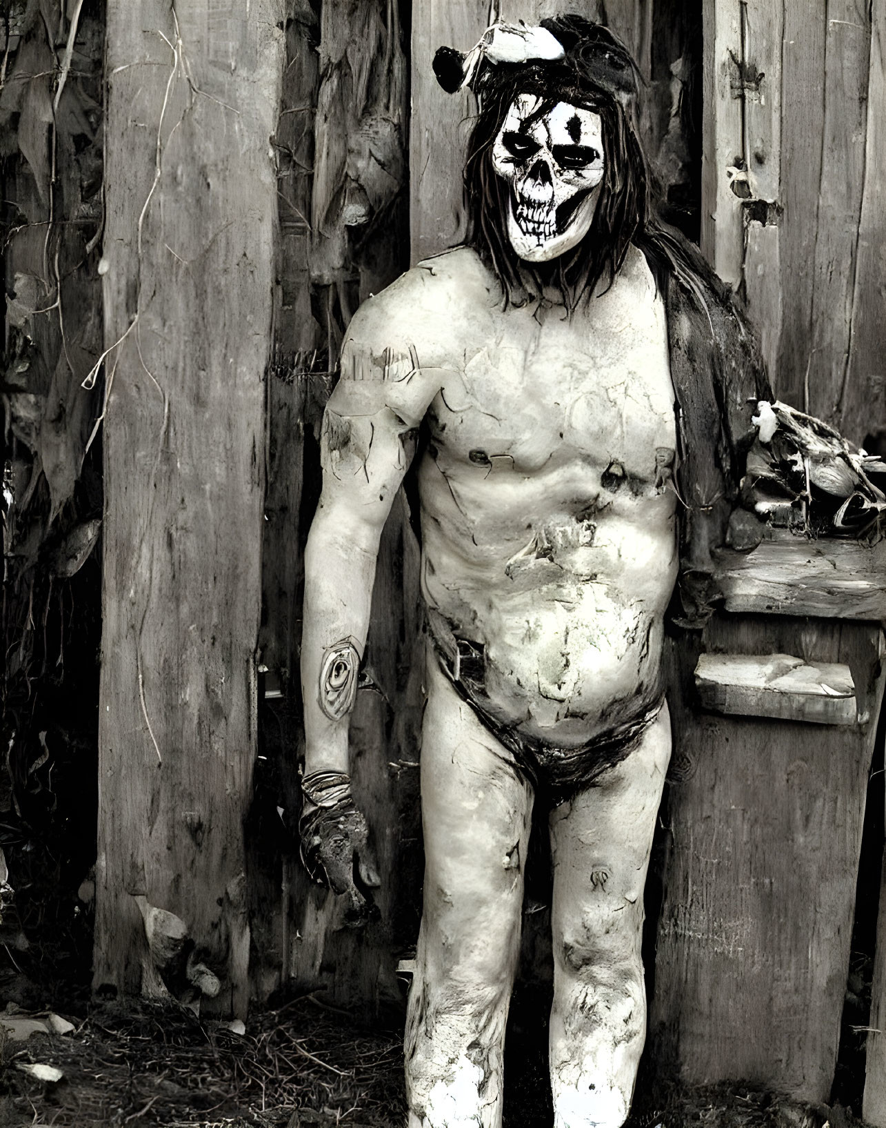 Person with skull-like face paint against wooden background