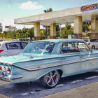 Classic Blue and White Car with Custom Chrome Details and Rims at Car Show