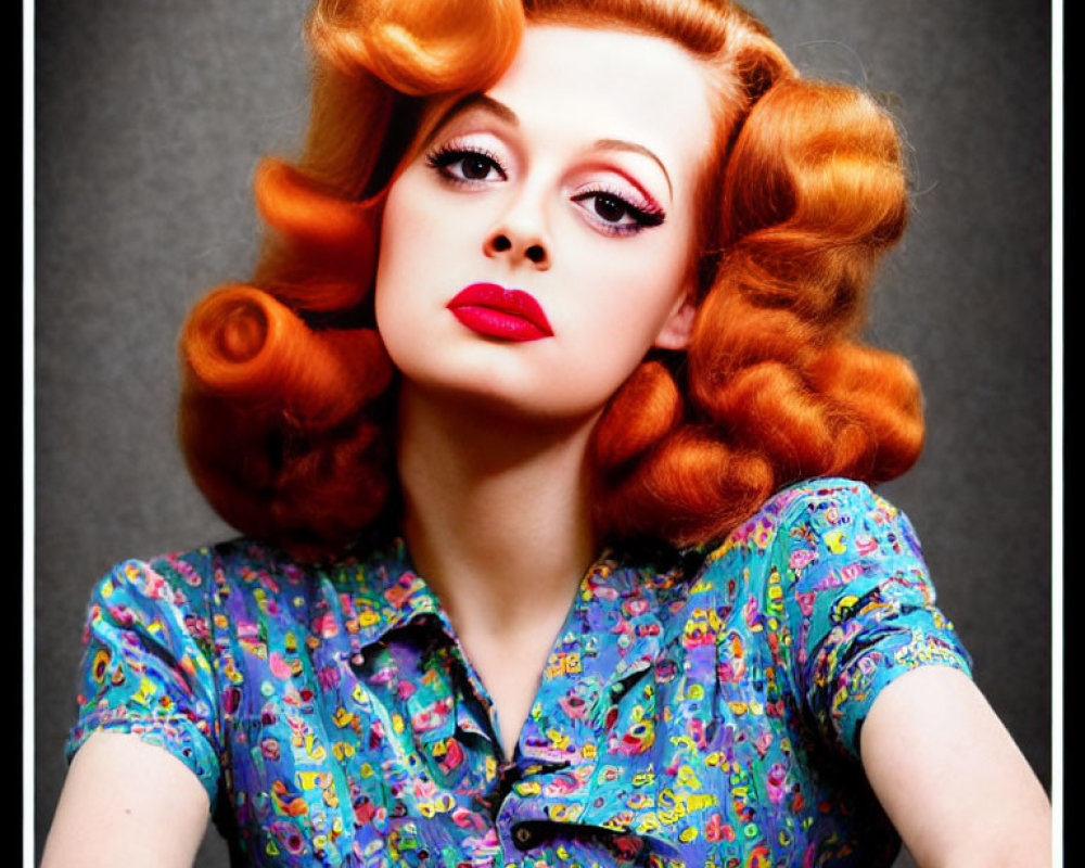 Vibrant red retro-styled hair and bold makeup on woman in vintage blouse