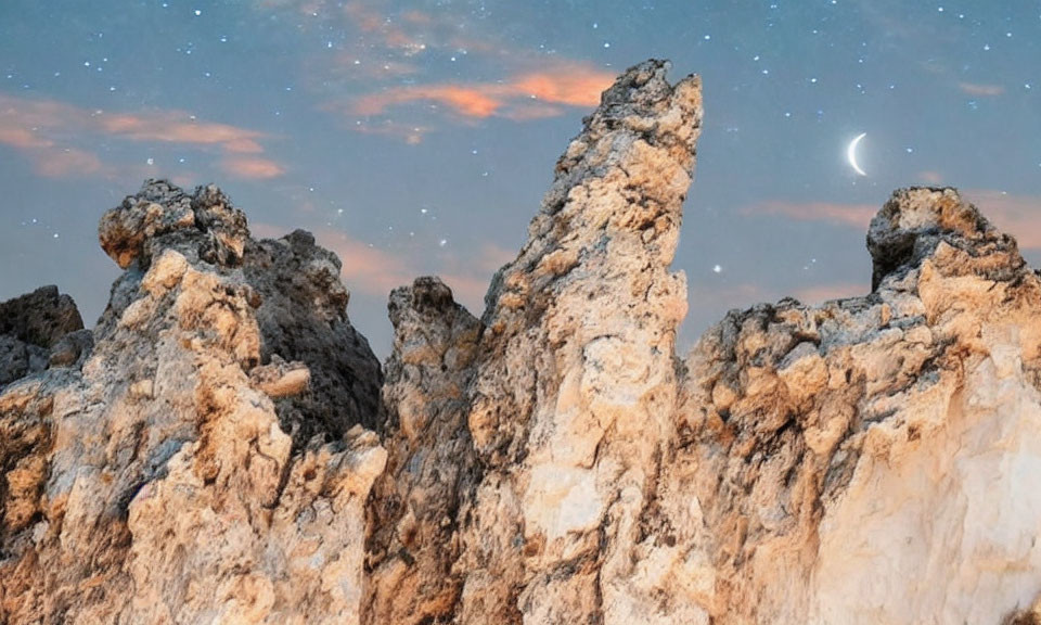 Twilight sky with rocky spires and moonlit stars