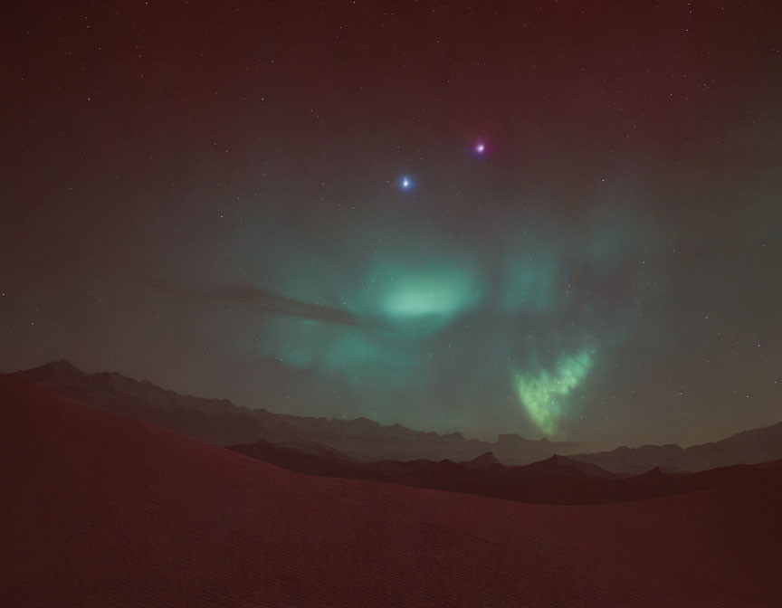 Vivid green and purple aurora over starry sky with mountains and desert.