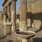 Ancient Roman ruins watercolor painting with columns, arches, and bright sky