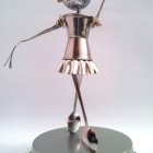 Metallic Ballerina Figurine with Ornate Headpiece and Costume on Pedestal with