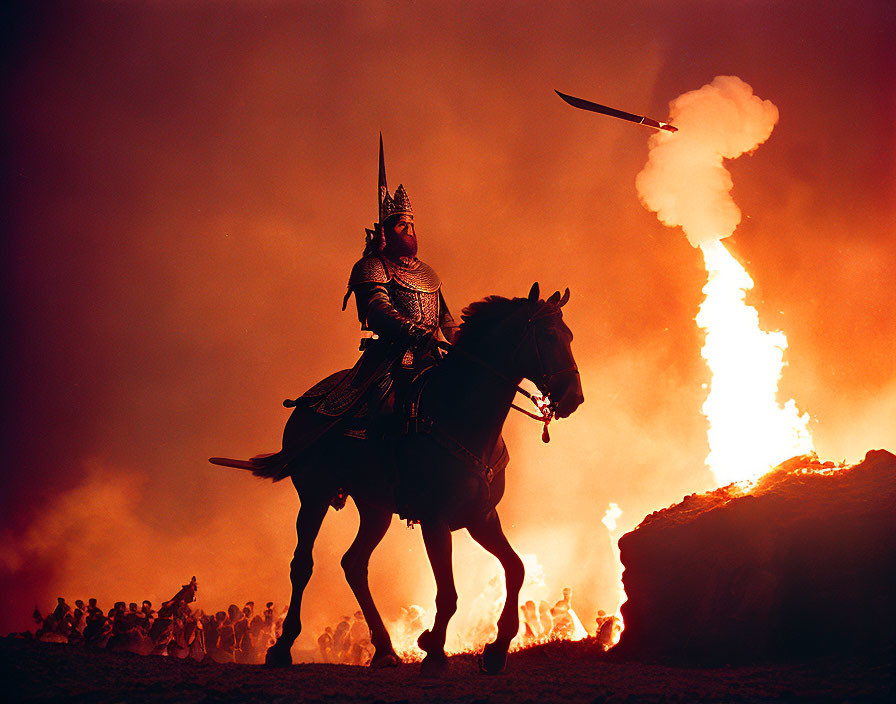 Armored knight on horseback with sword in fiery battlefield scene.