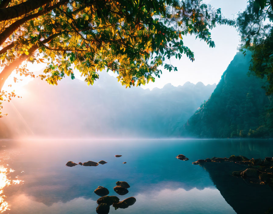 Serene Sunrise Scene: Misty Lake, Sunlight, Trees, Mountains
