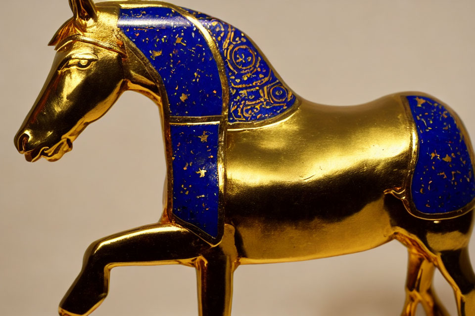 Golden Horse Figurine with Intricate Blue Patterns and Artistic Craftsmanship