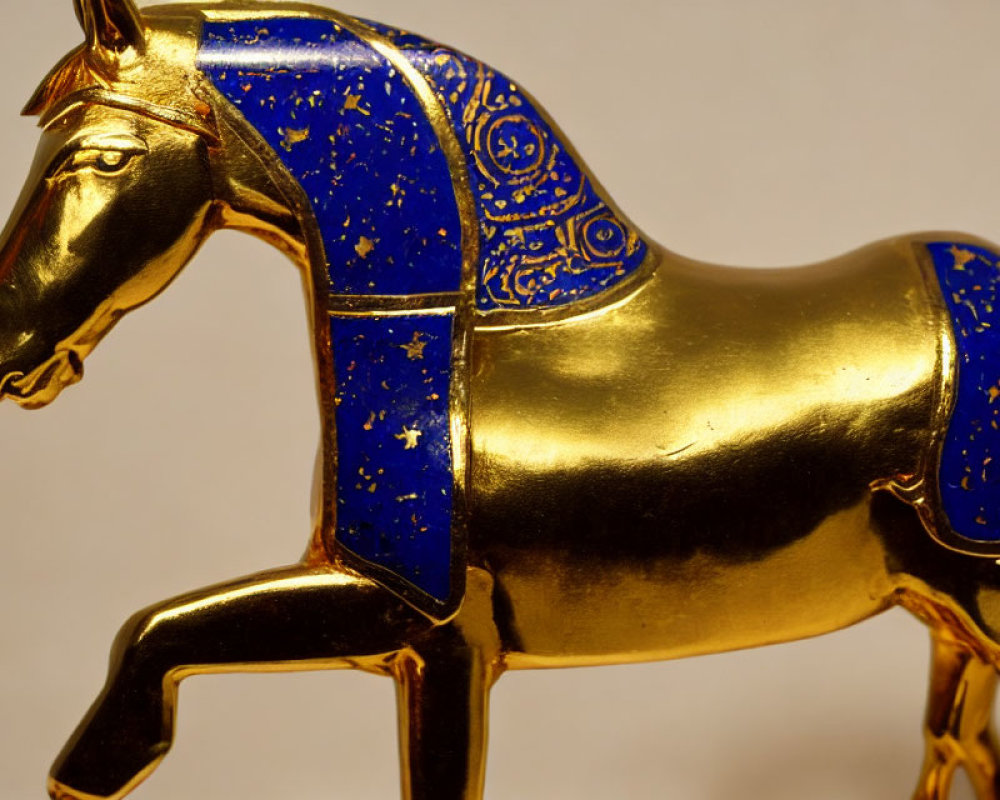 Golden Horse Figurine with Intricate Blue Patterns and Artistic Craftsmanship